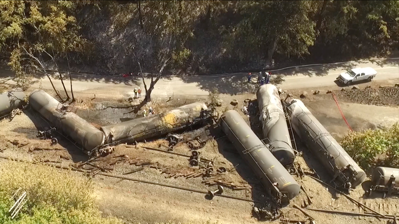 Crumpled oil tankers lie beside the railroad tracks after a fiery train derailment on June 3, 2016, that prompted evacuations from the tiny Columbia River Gorge town of Mosier, Ore. AP